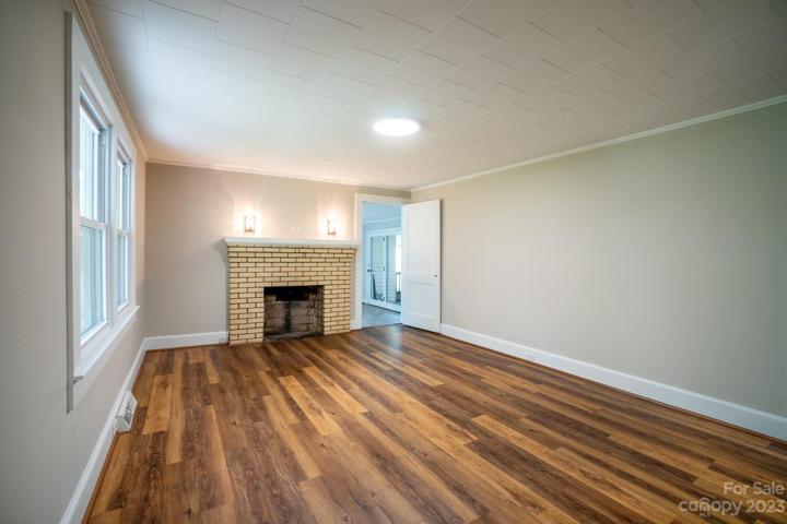 Freshly painted Living Room with fireplace and LVP flooring
