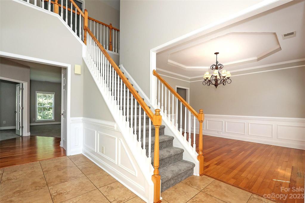 2 Story Foyer. Custom Wainscoting.