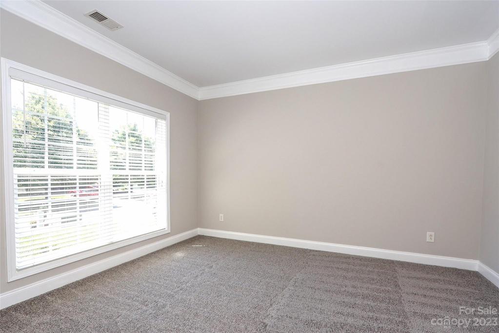 Living Room freshly painted and newly carpeted.