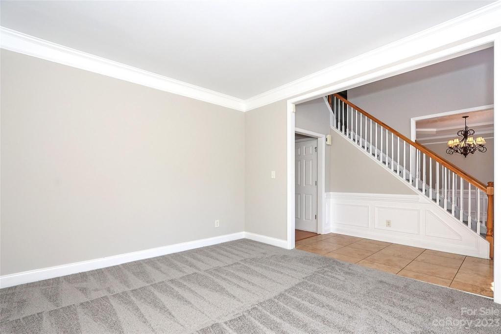 Living Room freshly painted and newly carpeted.
