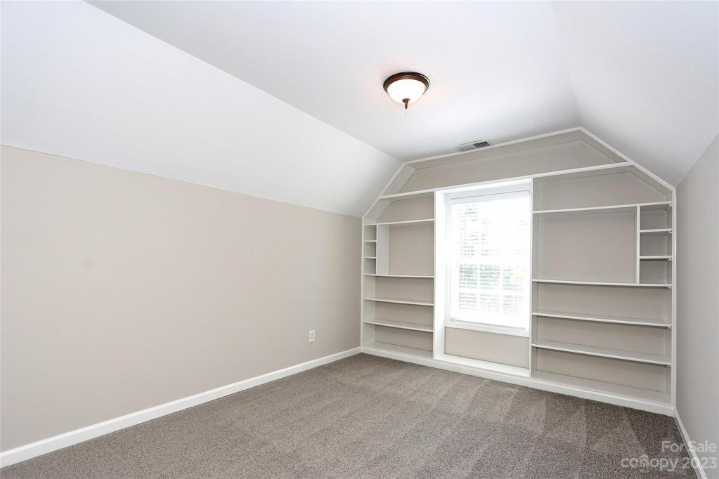 Sitting area w/Built Ins in Master Suite. Freshly painted, new carpet, walk in closet.