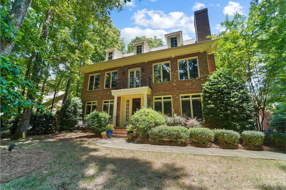 Traditional full brick home on 3/4 acre lot with mature trees