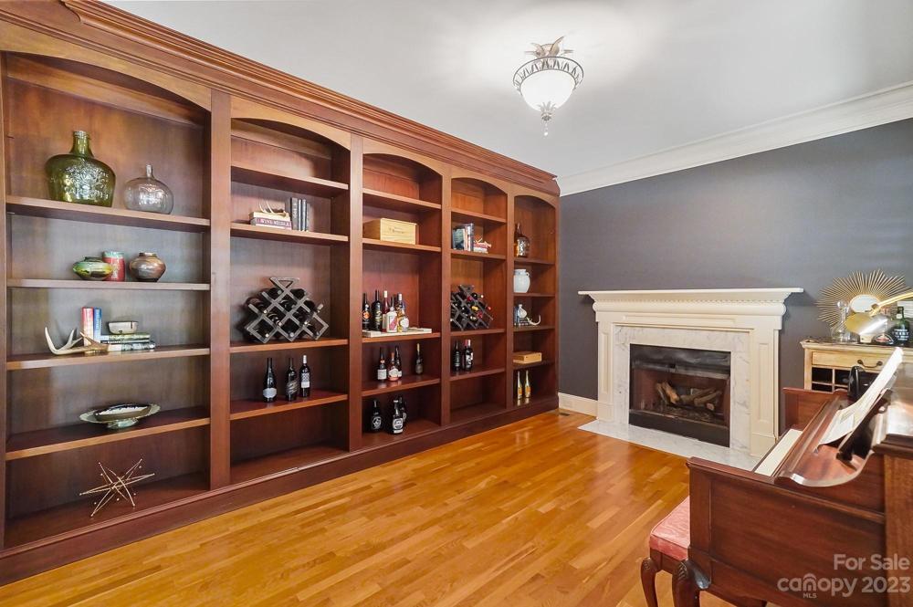 Sitting room/library/office with gas fireplace and built ins