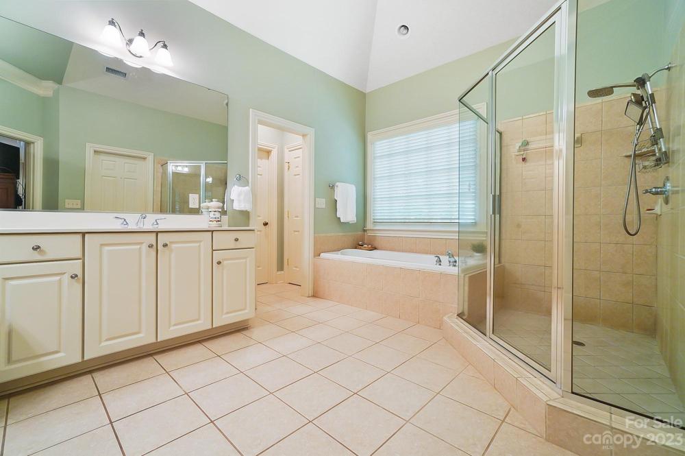 Primary Bathroom with large shower and double vanities