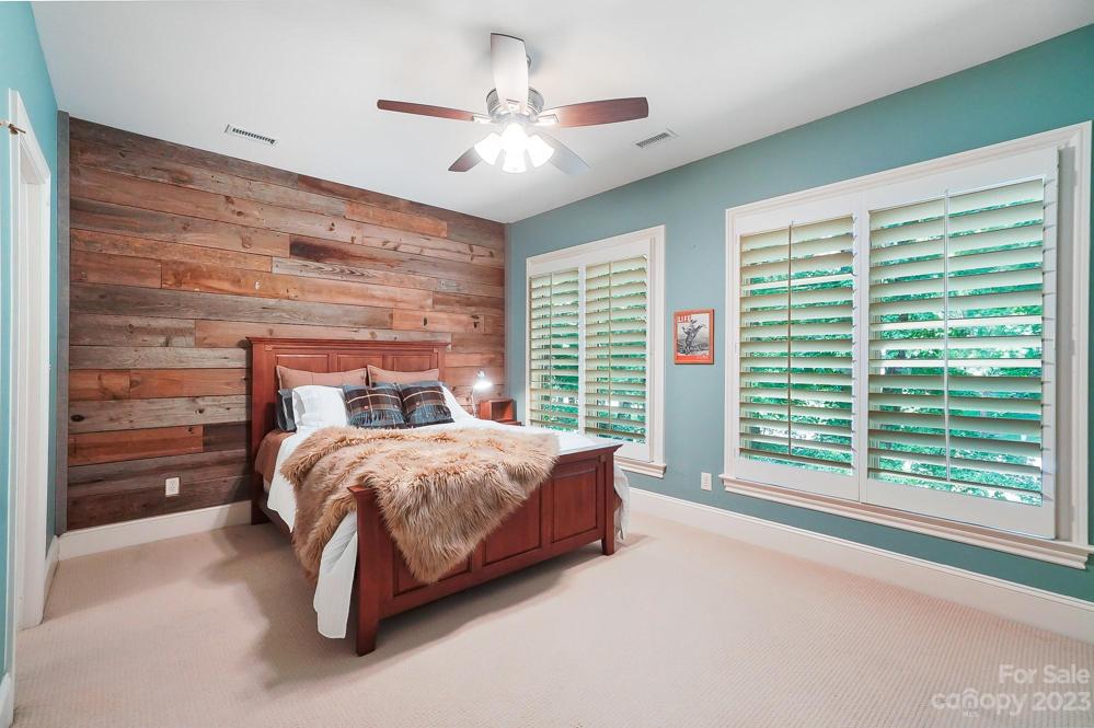 Bedroom 2 with wooden accent wall