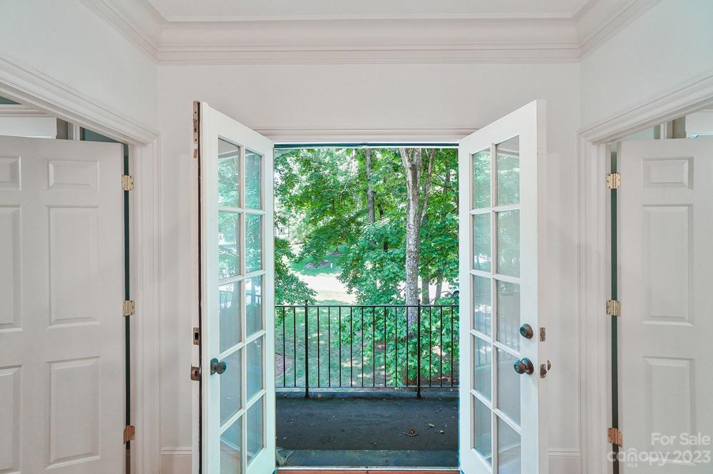 Sitting area opens onto terrace overlooking the front yard