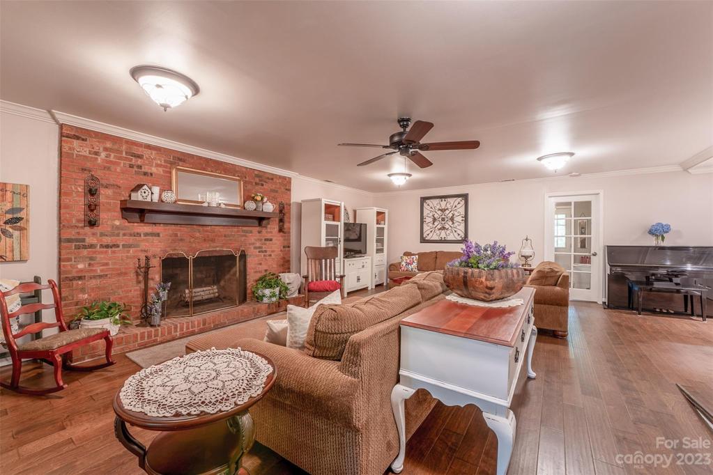 Sunken Living Room w/ massive brick fireplace