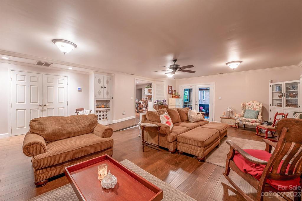 Custom built-in bar cabinet on back wall.