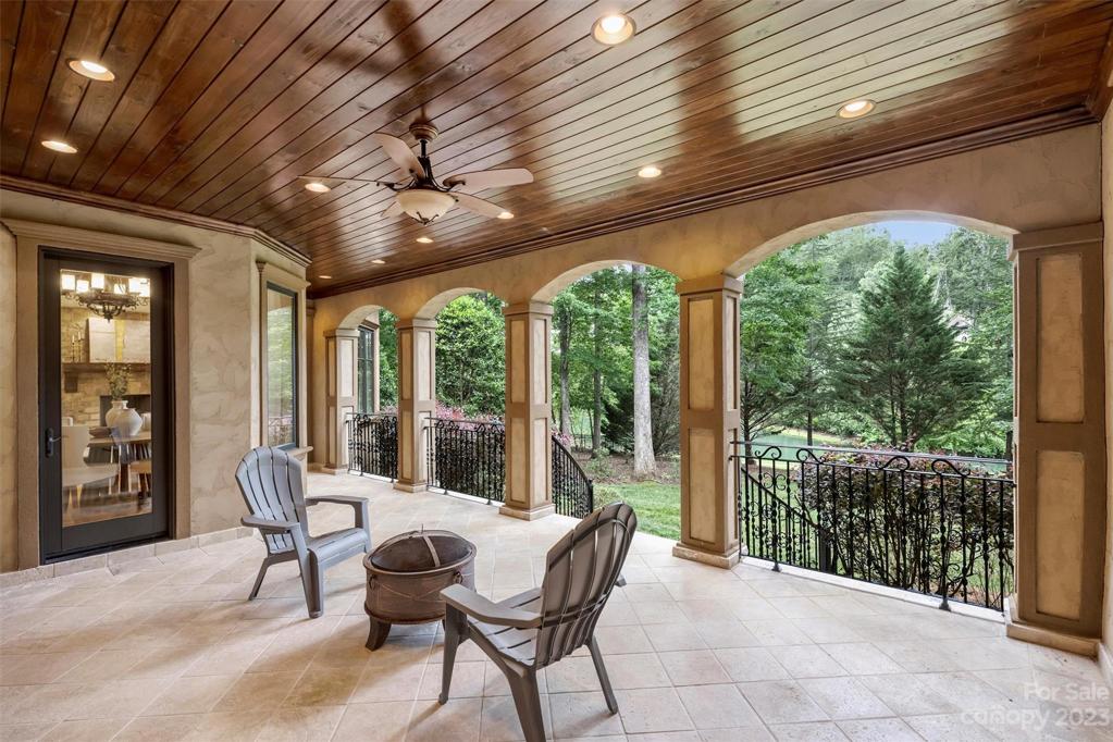 Main level covered porch with ceiling fan