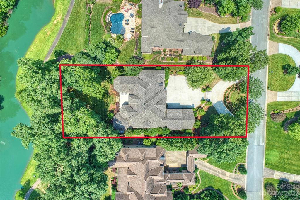 Aerial view with lot lines and pond