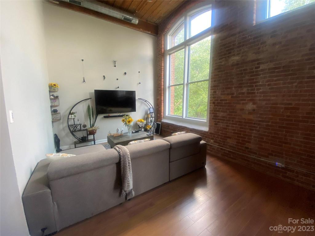 Living Room with exposed Brick wall.