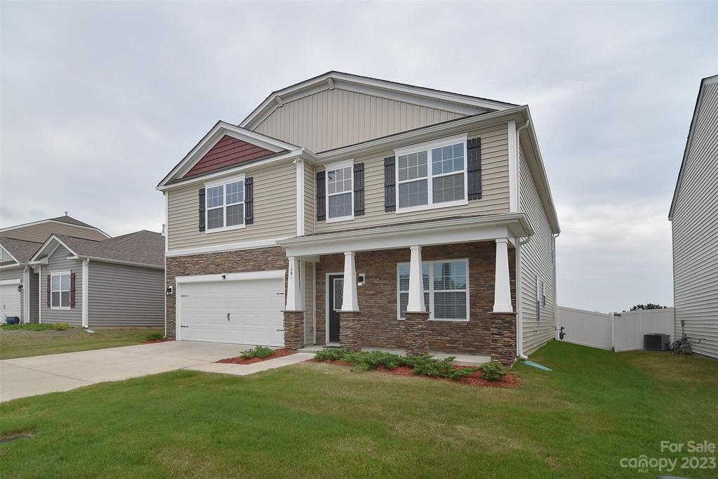 This home greets you with well maintained landscaping