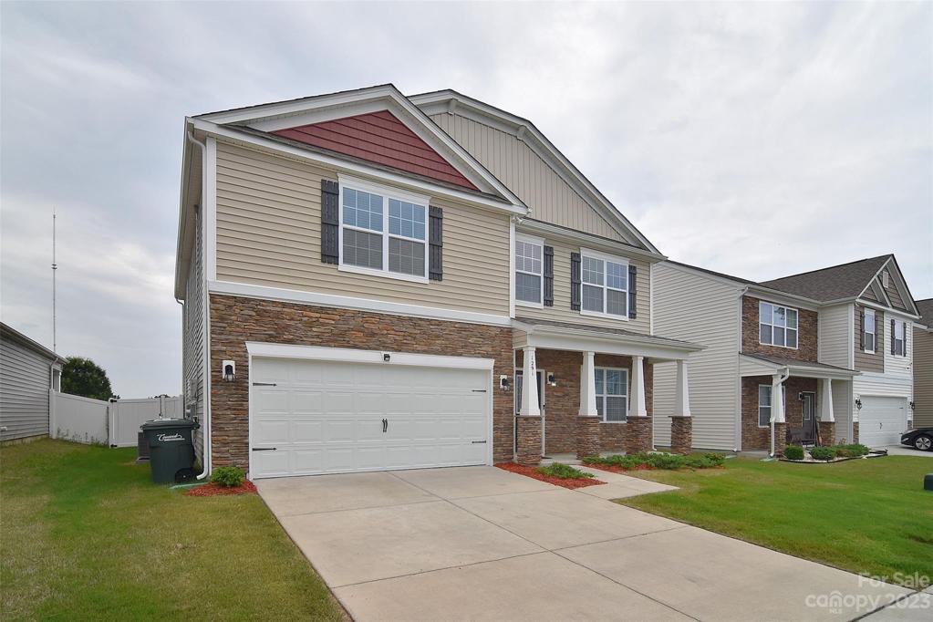The 2 car garage and driveway are perfect for extra storage and additional parking