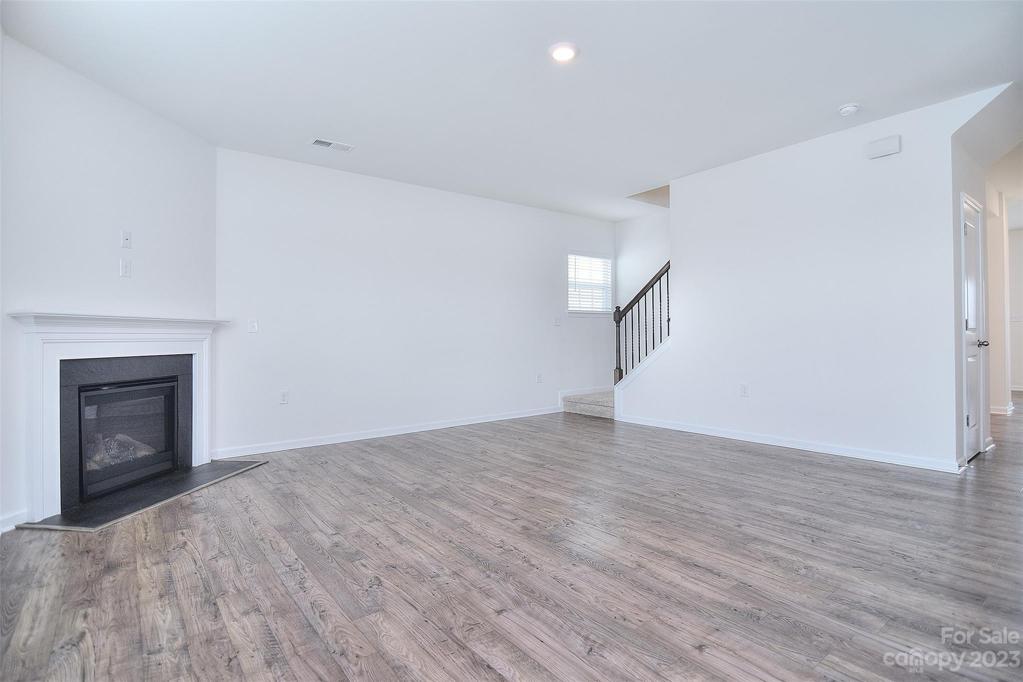 Family room includes fireplace and hardwood floors