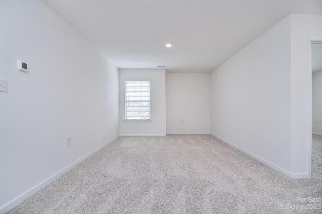 This loft/flex space would be great for a home office, play area, or workout space!