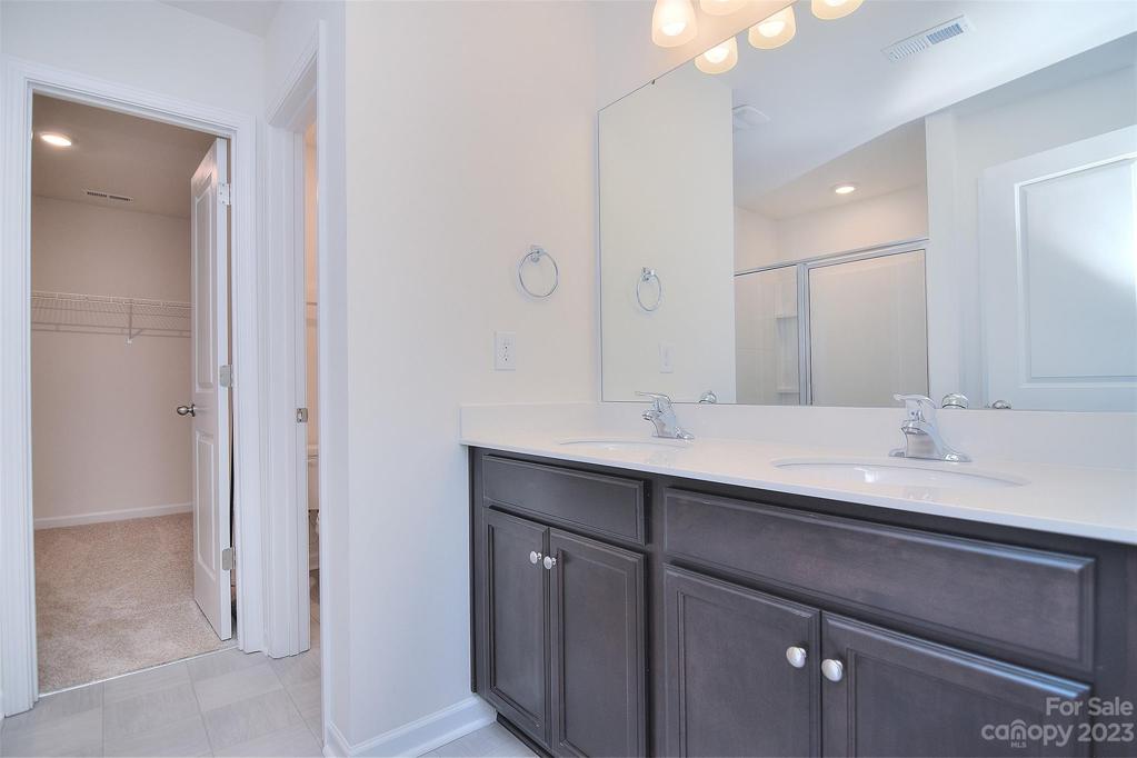 Primary en suite includes dual vanities, water closet and walk in closet