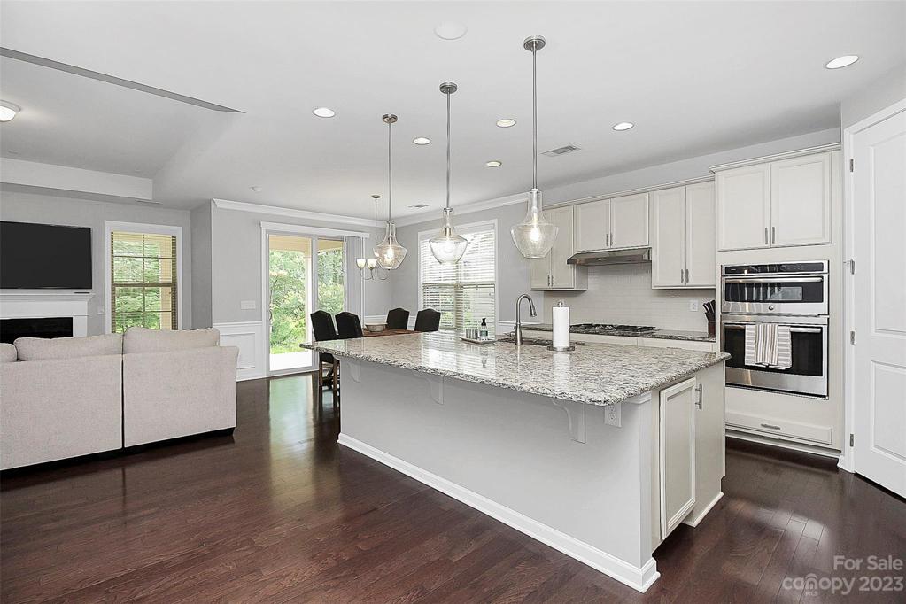 Oversized island with granite countertops