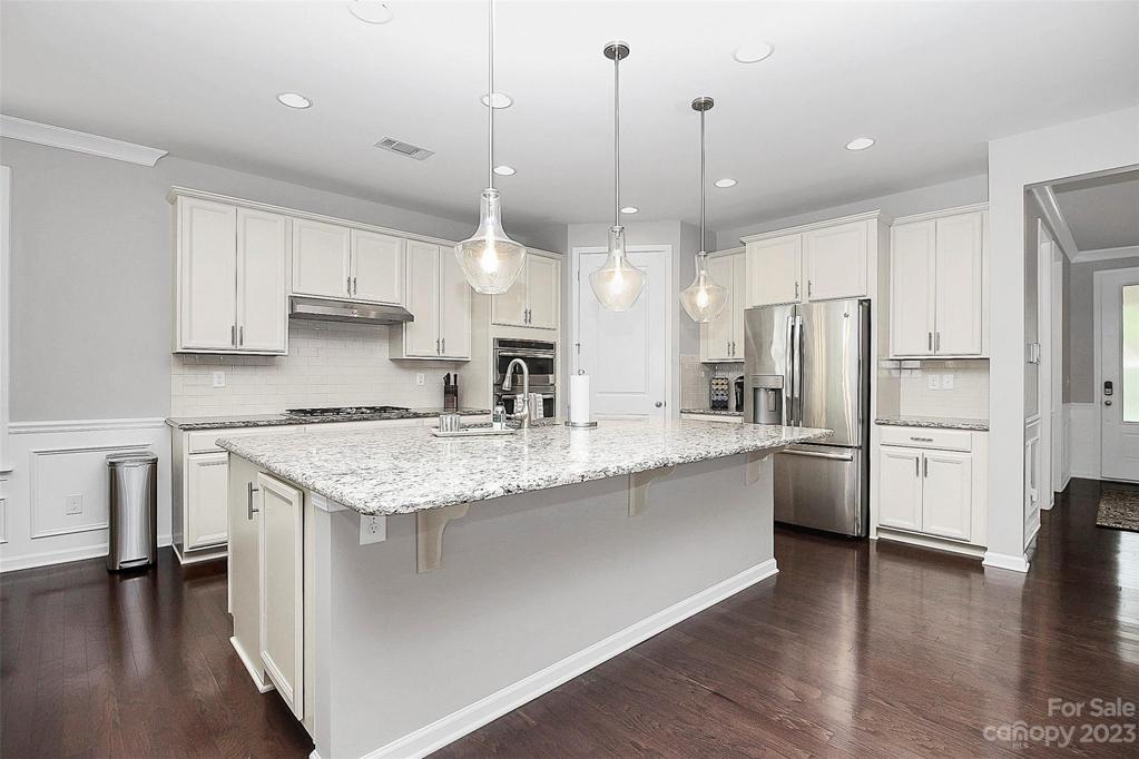Plenty of cabinet storage + walk-in pantry