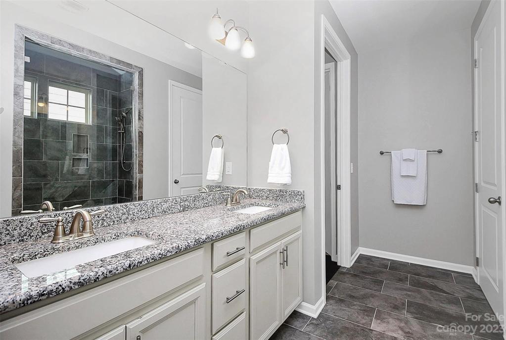 Spacious spa-like bathroom with dual vanity