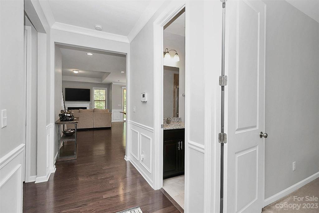 Front hallway with a bedroom + hall bathroom to right