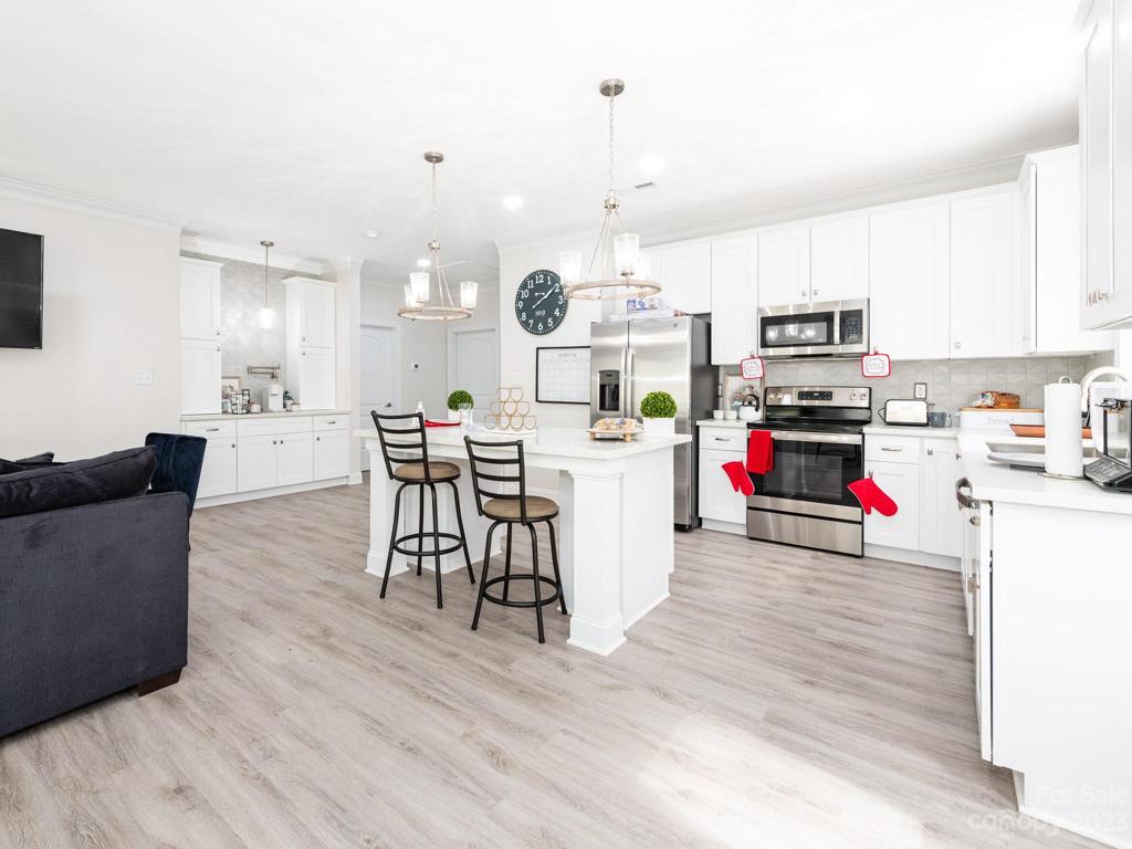 Representational Photo - Open Living Dining and Kitchen