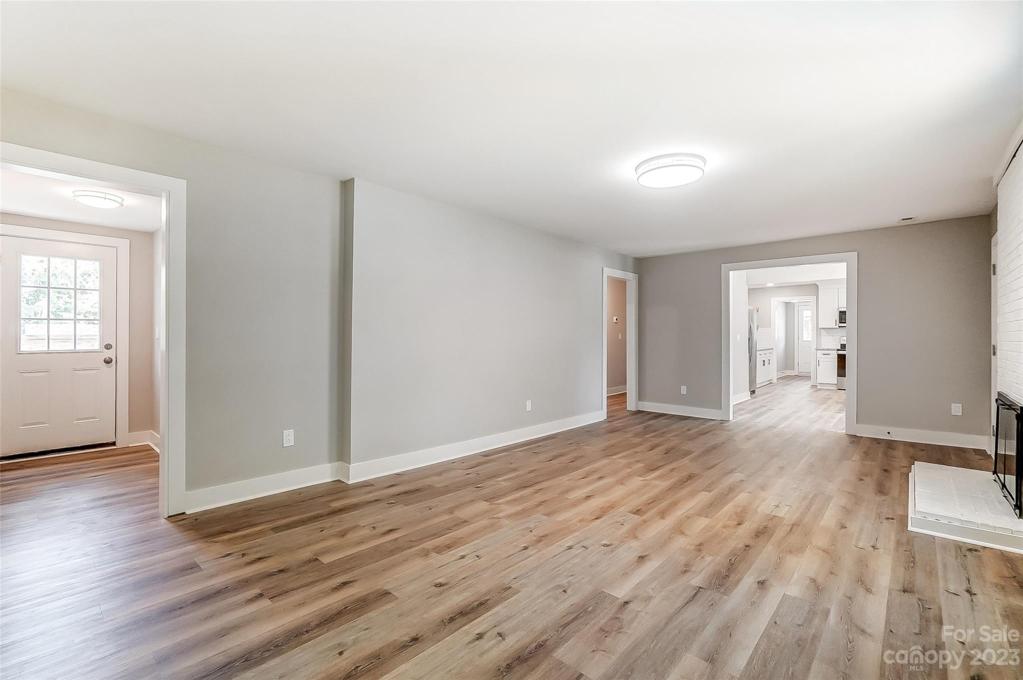 The living room is the hub of this split bedroom layout home.