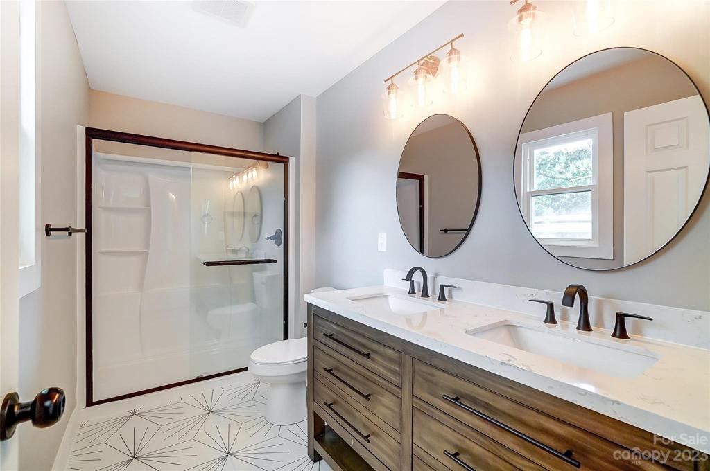 Sleek and sexy primary bathroom is sure to impress!