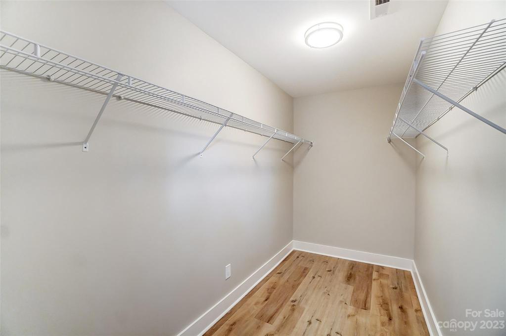 Large walk-in primary closet.