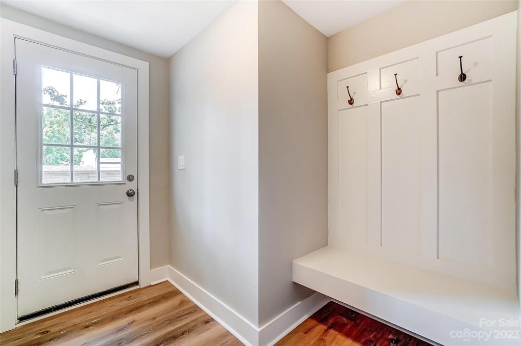 Drop zone provides access to the back of the home and is conveniently located off the living room.