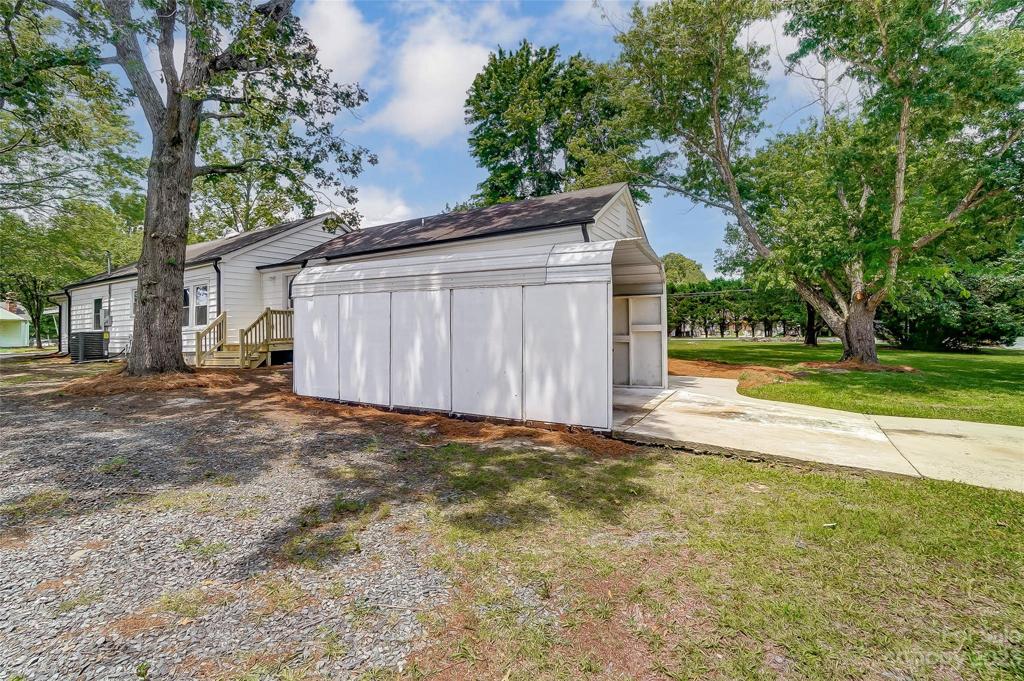Additional shed for parking or storage, you decide.