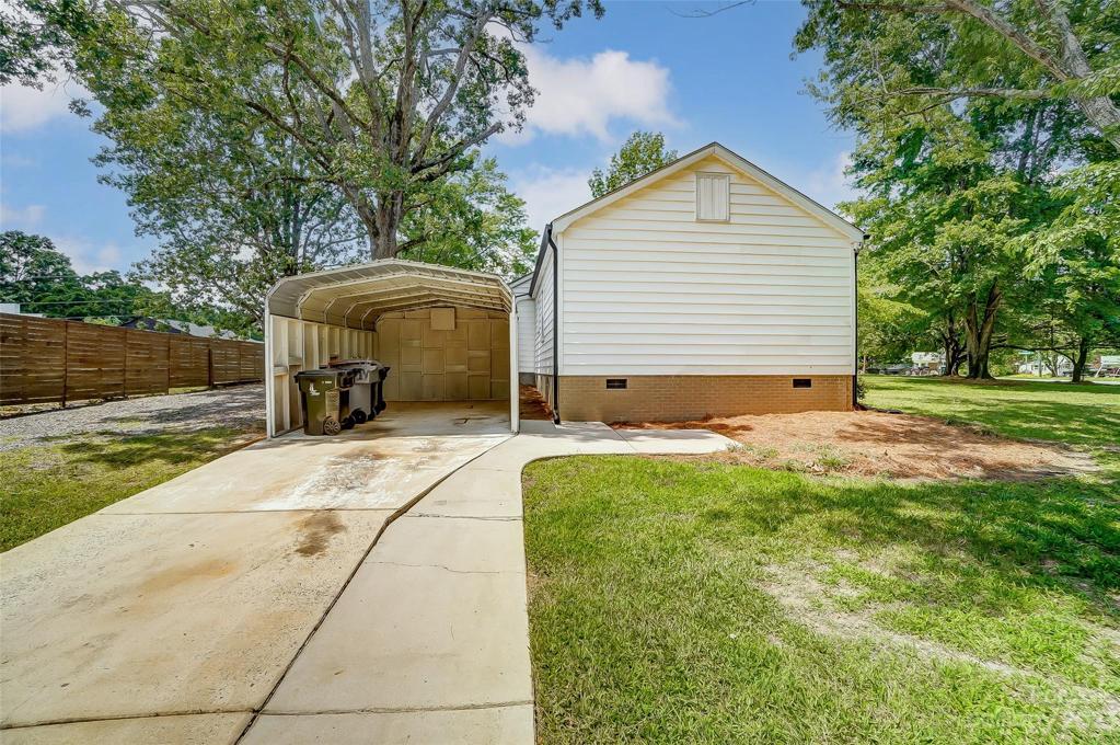Side load driveway provides additional parking options.