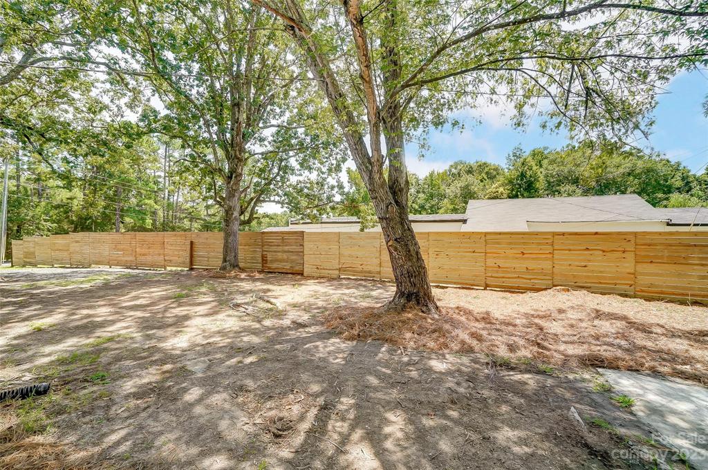 Privacy fence makes this a great space to develop into your oasis.
