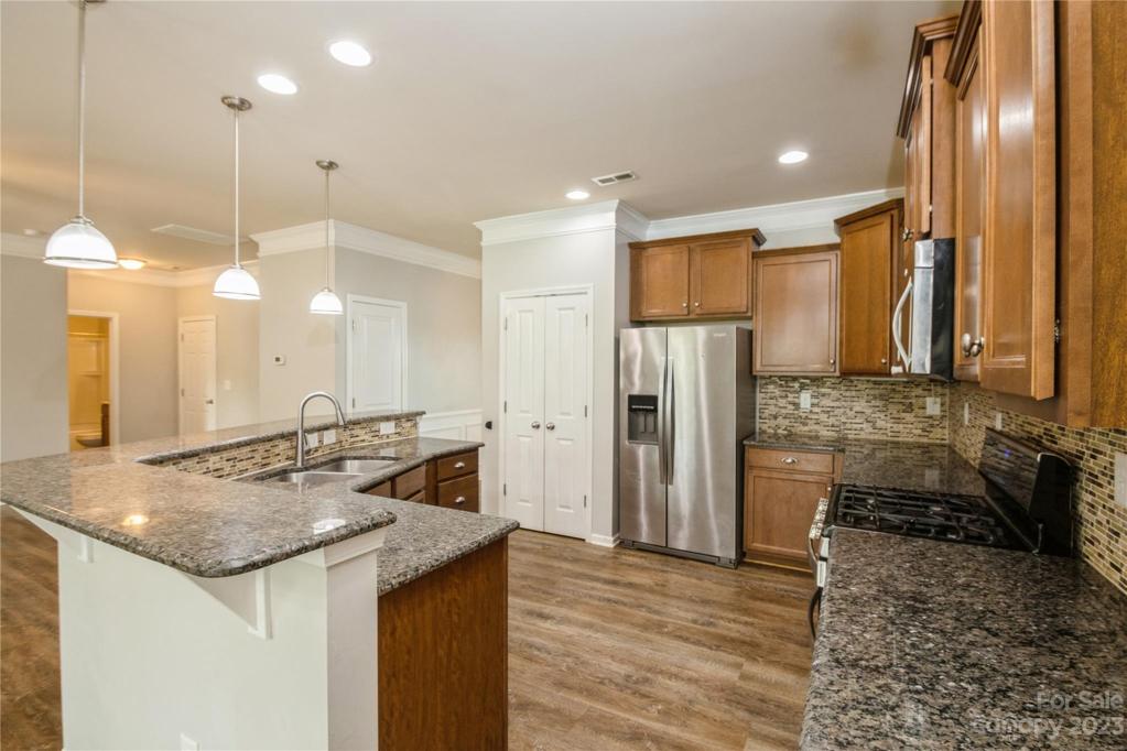 Kitchen with breakfast bar and stainless steel appliances