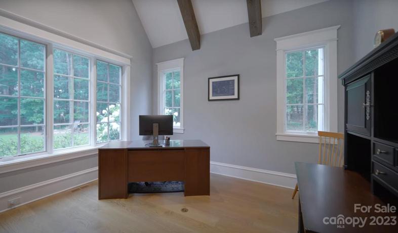 Home office w/ vaulted wood-beamed ceilings