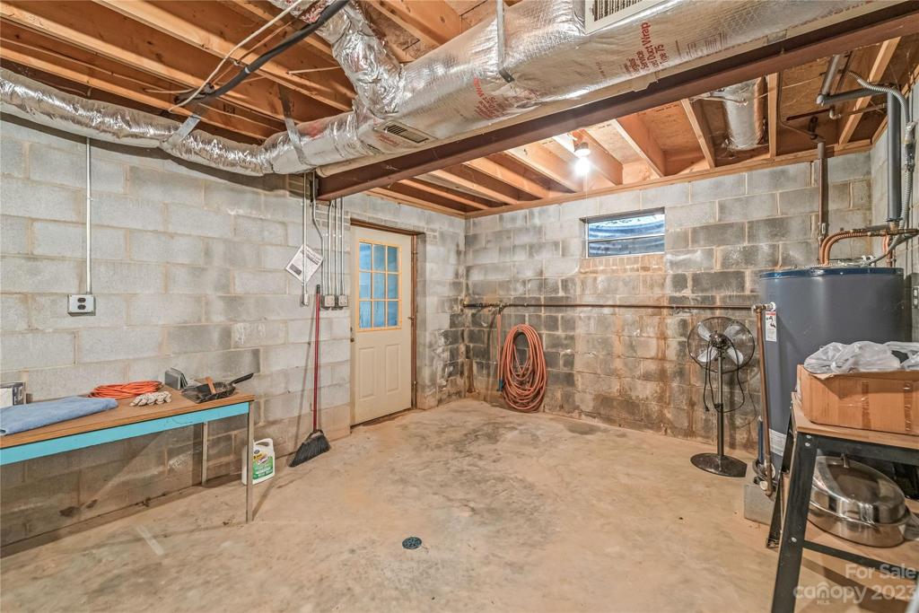 Exterior door in basement with stairwell up to the side yard