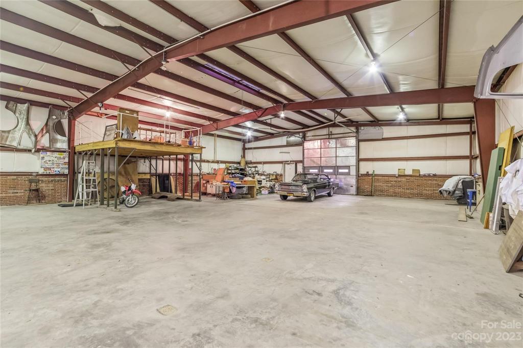 3 roll up garage doors and 3 entry doors