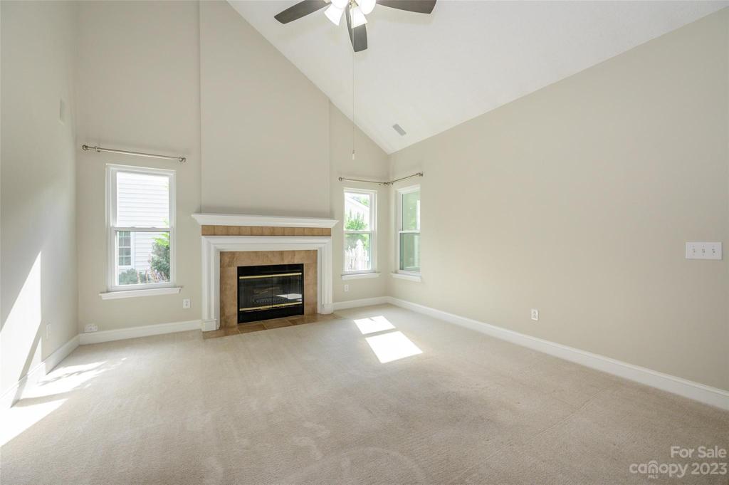 Living space with fireplace and vaulted ceiling