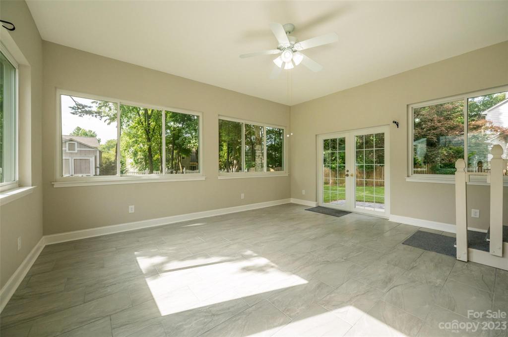 Sunroom with lovely views of the back yard. Tile flooring