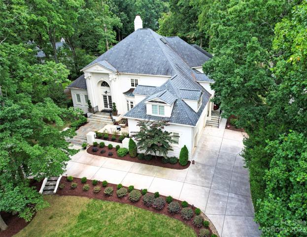 WELCOME HOME: stunning custom home after an award-winning 2020 renovation...offering spectacular golf course views from both the front and the rear.