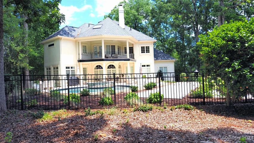 Full black aluminum FENCED backyard that faces the green for the 16th hole.