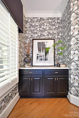 Quartz countertop cabinetry. (Both electric panels are on this wall)