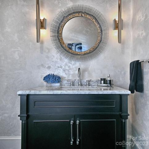 HALF BATHROOM Foyer: new vanity, marble countertop, gem style fasceted faucet by BRIZO®.