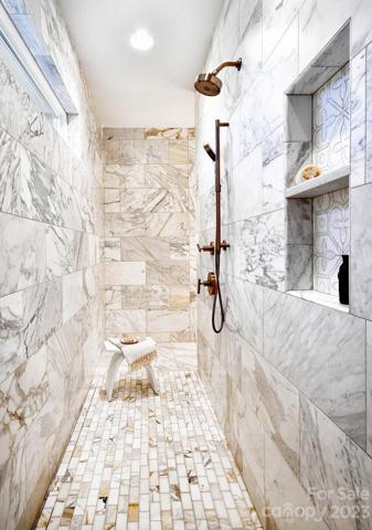 Full Marble dual entry walk-in shower. Recess fan & Light combo in shower.