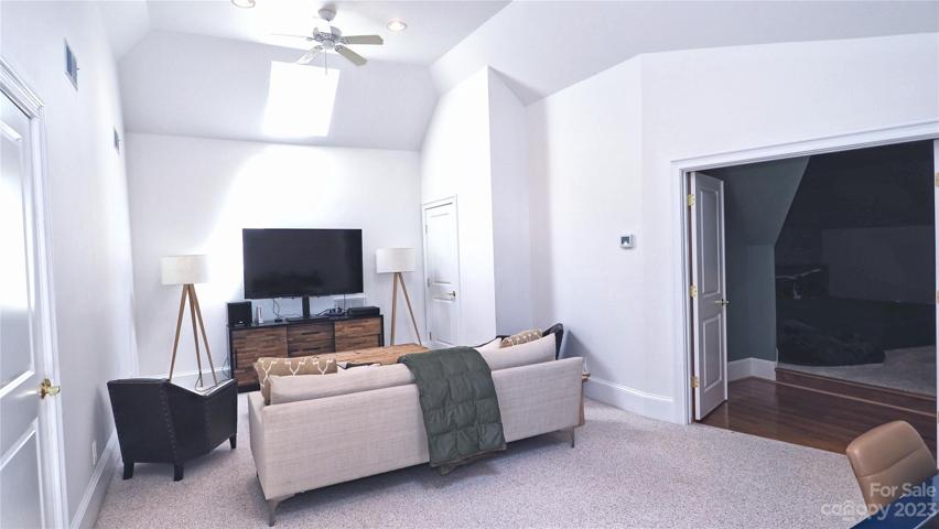 MEDIA ROOM / GAMEROOM  and BEDROOM (Third Floor): En-suite has a kitchenette, bedroom (now paited in white) with an multi angled ceiling , walk-in closet and its full remodeled marble tiled bathroom with quartz countertop cabinet as well.