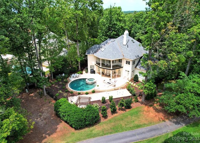 HALF-ACRE lot with recent designer landscaping and new backyard irrigation system.