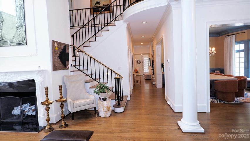 FRONT STAIRS: black iron railing with brass handrail.