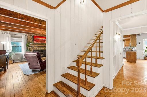 Welcome Home! The beautiful hardwood floors and beams flow throughout the main living areas.