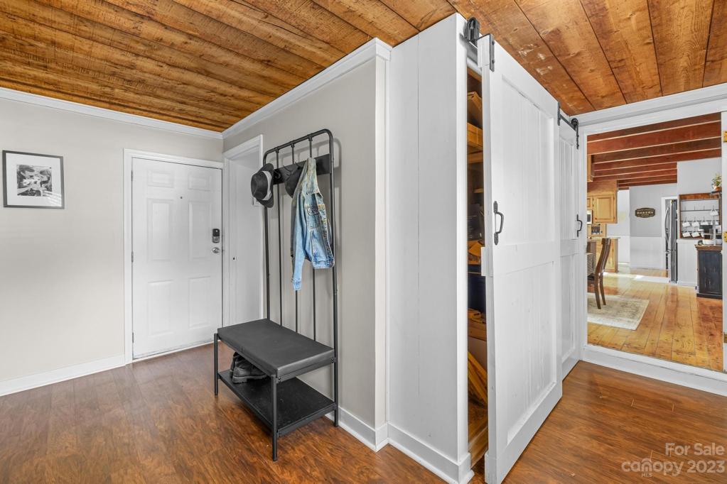 Hallway to Flex Room, back deck and main level full Bathroom