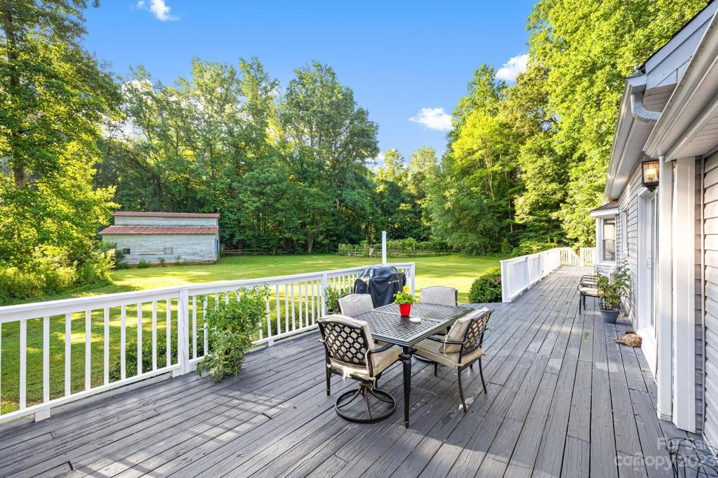 Huge deck for relaxing in the rear yard,