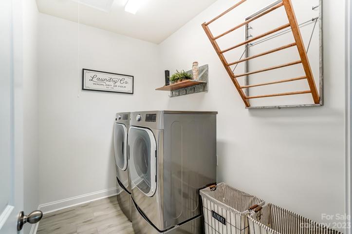 Upstairs laundry room with pottery barn laundry shelf/rack